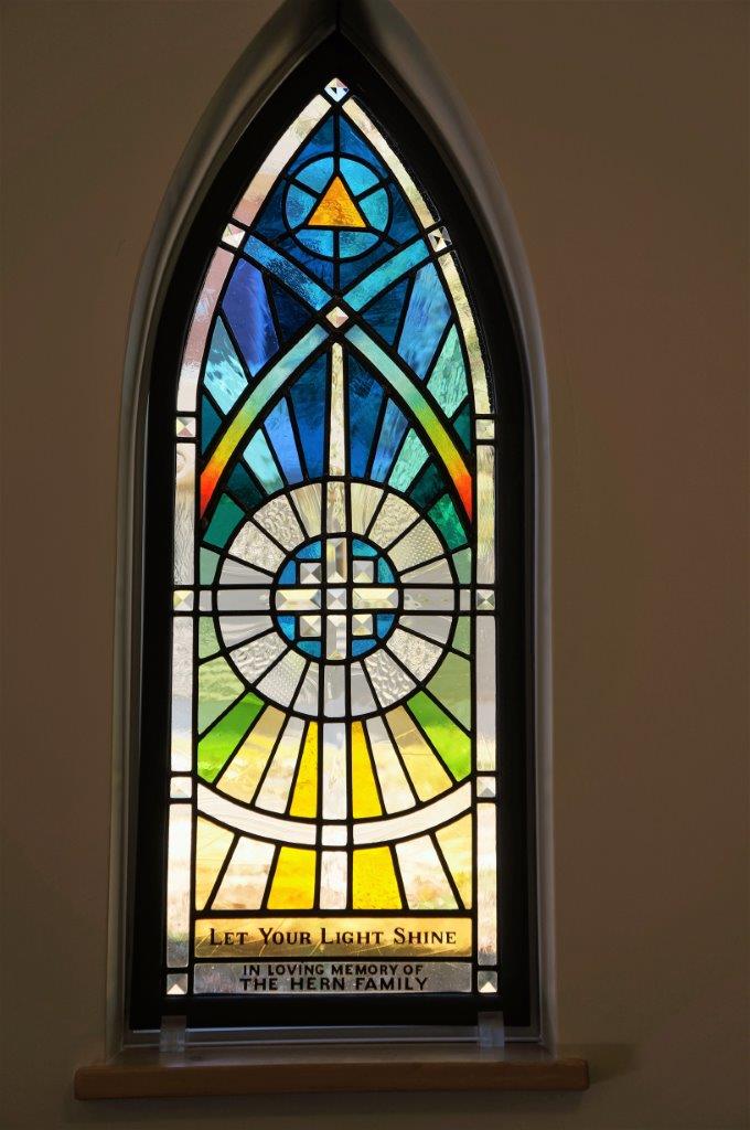 Local artist creates new memorial stained glass windows for All Saints