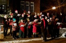 The Huntsville Community Choir sang cheery holiday carols prior to the tree-lighting on the Town Hall steps