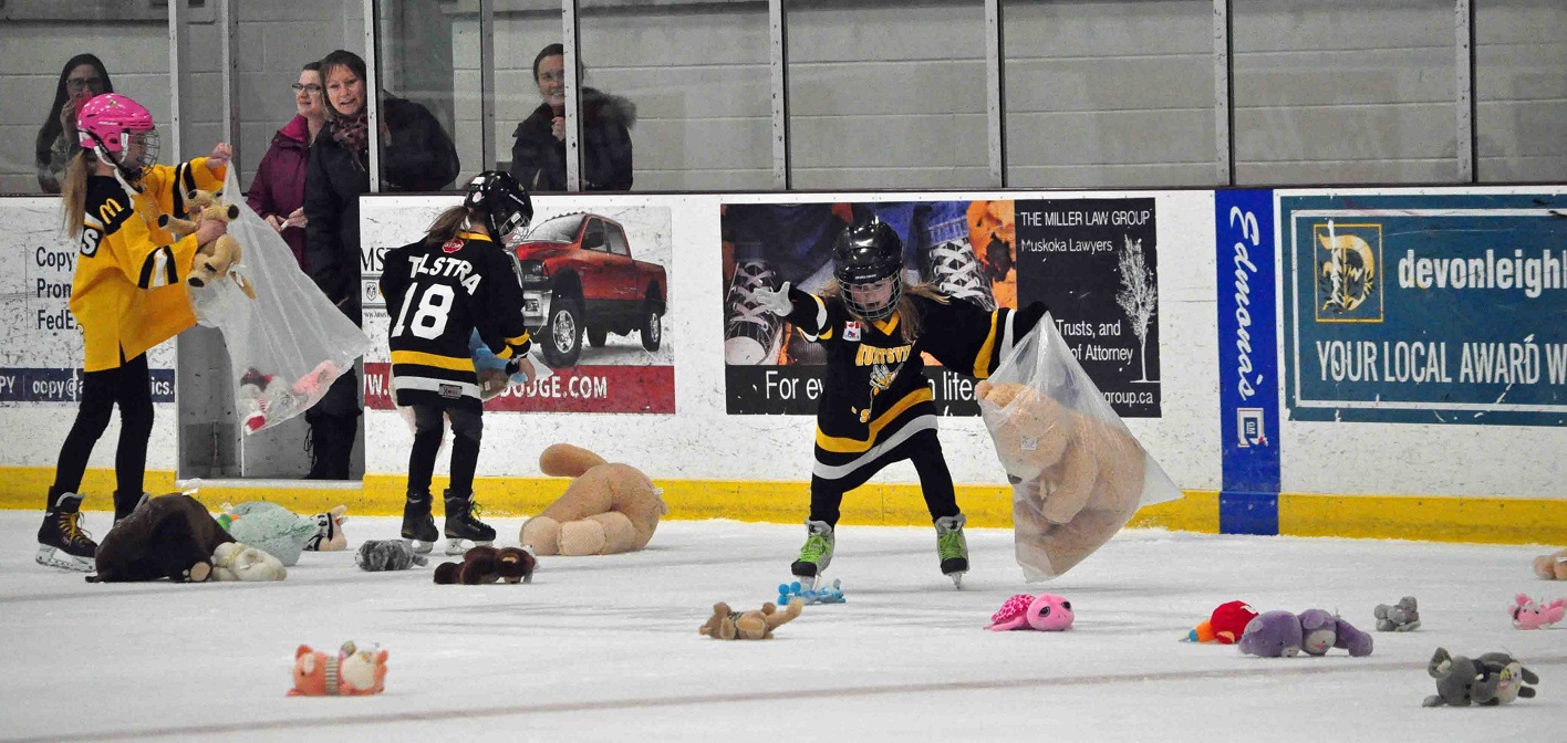 Huntsville Sting players volunteered to collect the teddy bears at the Jr C Otters annual Teddy Bear Toss
