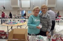Inga Allan and Friedel Taylor fill mugs with goodies