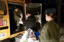 (From left) Warrant Officer 2nd Class Cain, Richard Cusson, and Air Cadet Standing unload donations