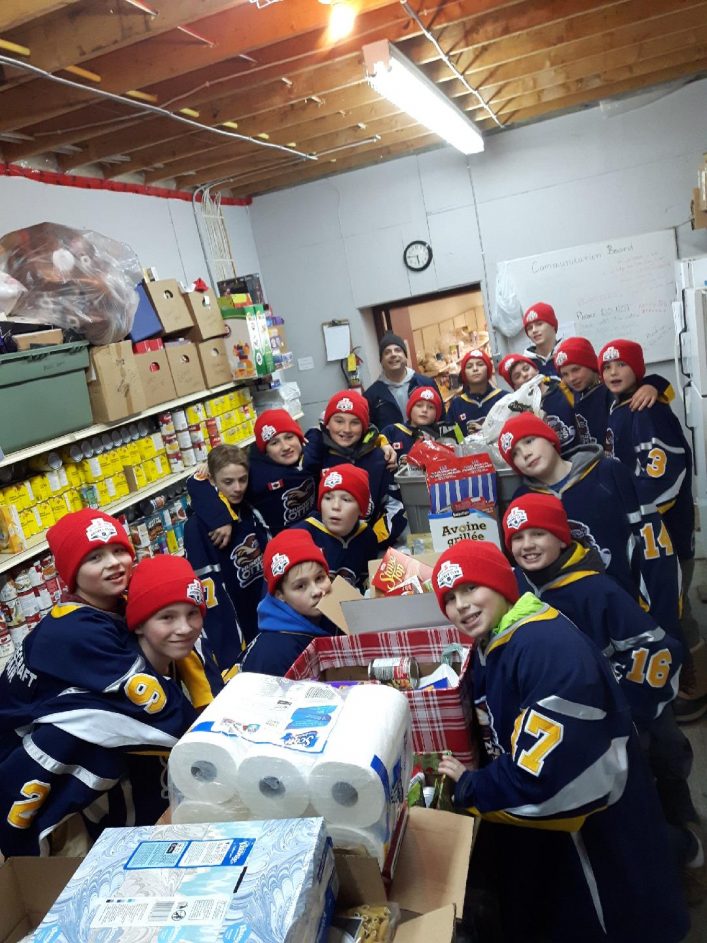 The Huntsville Peewee Rep Otters deliver their donations to The Table food bank (Photo: Vicky Perentesis)