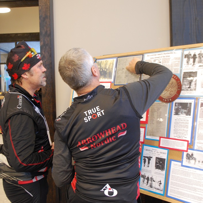 Steve Jones (left) and Harvey Chapman from Arrowhead Nordic Club check out some vintage ski photos