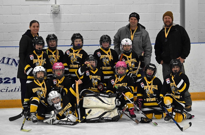 The Novice Sting won gold in their home tournament (back from left) coaches Erin Torrance, Jeremiah Tilstra, Jeff Earl and Krista Earl; (middle row from left) Sophie Mann, Lauren Torrance, Tessa Easy, Lachlan Calligan, Lily Gamper; (front from left) Sydney Kerr, Mackenzie Adams, Miah Tilstra, Journey Chambers, Liliana Henderson, Molly Wolgemoth, and (in front) goalie Waverly Earl.