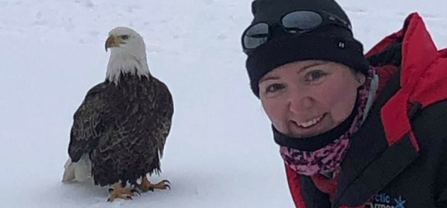 Tourists have experience of a lifetime when bald eagle joins them for some ice fishing