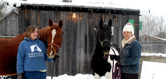 Sue Dixon (left) with Reba and Delena Jennings with Mojo at Sugar Foot Farm near Utterson