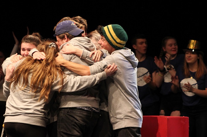 HHS Moot shares a group hug following their win (Photo: Madi Jones)
