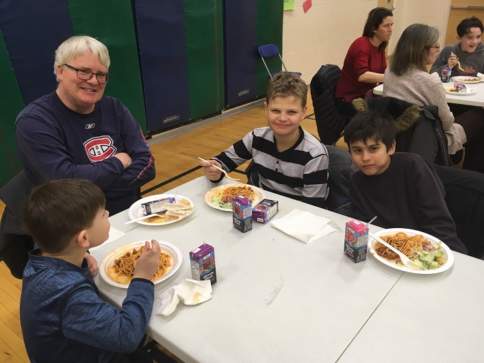 Yummy spaghetti gives (from left) Aaron, Doug (Grandpa), Jackson, and Darius something to smile about (supplied)