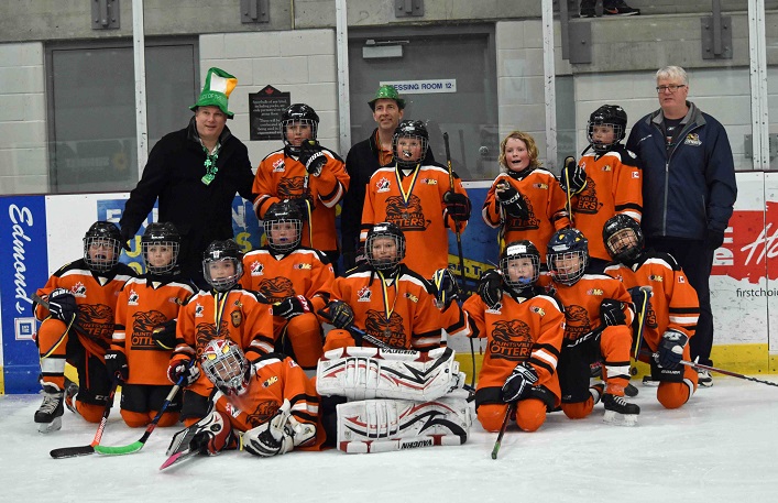 The Little Caesars House League Otters (back from left) coaches Mark Urbanski, Matt Kendall, Doug Whitfield; (middle row from left) Lyle Lovegrove, Jonah Gonthier, Sterling Boothby, Jackson Saunders; (front from left) Isaac Moeller, Harlen Wreggitt, Jakob Nicholls, Tyler McCrea, Jaxon Urbanski, Jackson Graham, James Dooley, Karl Faubert: and (lying in front) goalie Gavin Kendall