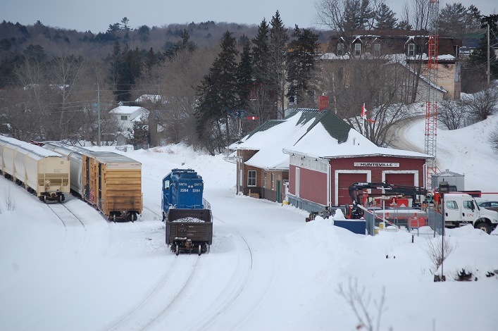 The locomotive sometimes moves cars around, but often sits idling next to the station