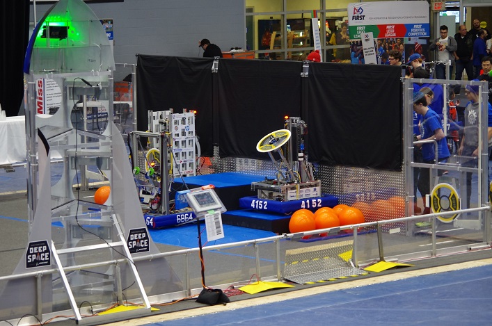 The Hoya Robotics team just about to start a match. Their robot is 4152, and team members are visible on the other side of the wall. (supplied)