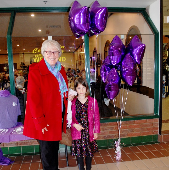 Avery Adams (right) with Connie Gould was excited to take home a purple balloon. She even asked for one for her older sister, Darian.