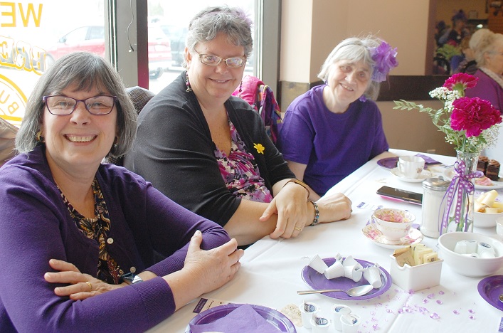 Linda Brodie (left) was surprised at the tea party by friends Kelly McKeown and Judy Radway from Mississauga and Brampton respectively