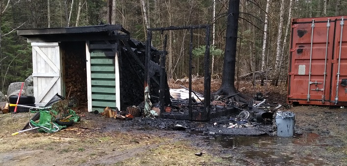 Embers from a nearby burn barrel are the suspected cause of this fire in Port Sydney (supplied)