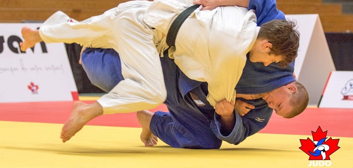 Jeff Allen (in blue) brings an opponent to the ground (Photo: Rafal Burza)