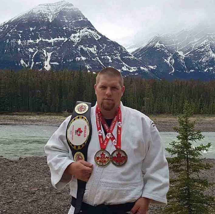 Jeff Allen with his latest gold medals and gold belt (supplied)