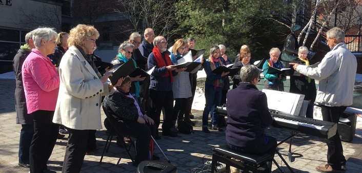 Members of the Huntsville Community Choir perform in front of the Algonquin Theatre (supplied)
