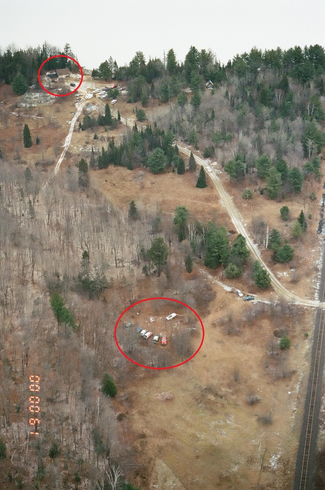 An aerial view of the farm with the home and Joan Lawrence's nearby shed in the upper left, and the location of the van where she later lived near the bottom (OPP)