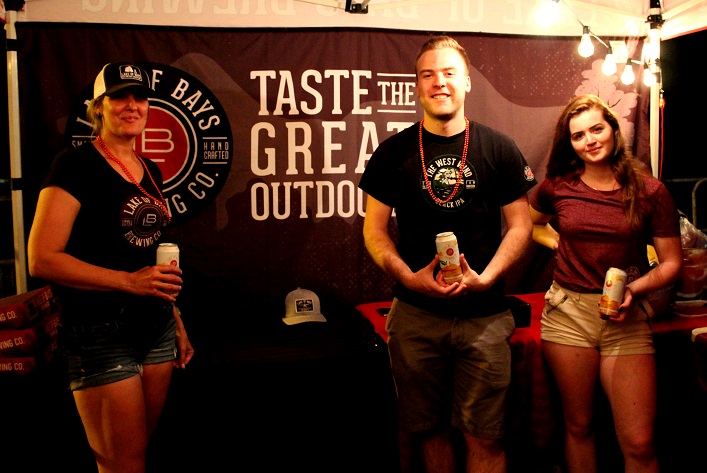 (From left) Mel Mercier, Tyler MacKay and Megan Starbuck served up cold brews at Huntsville Brewhouse beer garden, a new addition to this year's Midnight Madness