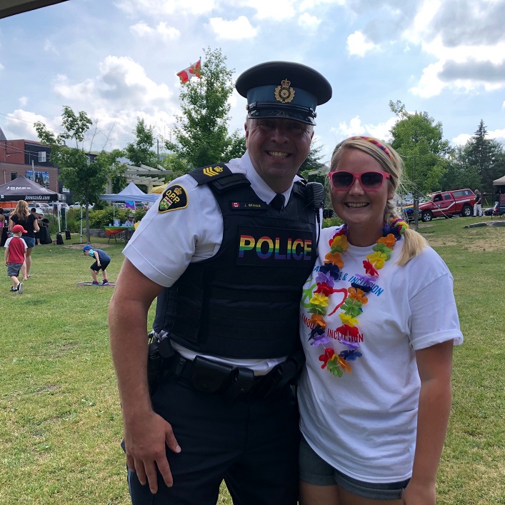 Caitlin Griffin with Huntsville OPP Detachment Commander John-Paul Graham, who said he wishes he could wear the rainbow badge at work every day