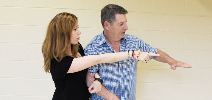 Tasha Bryant (left) and Ian Crowley talk choreography for Huntsville: A Choral History