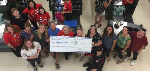 Community Living Huntsville receives almost $2,500 donated by Bullock’s YIG customers