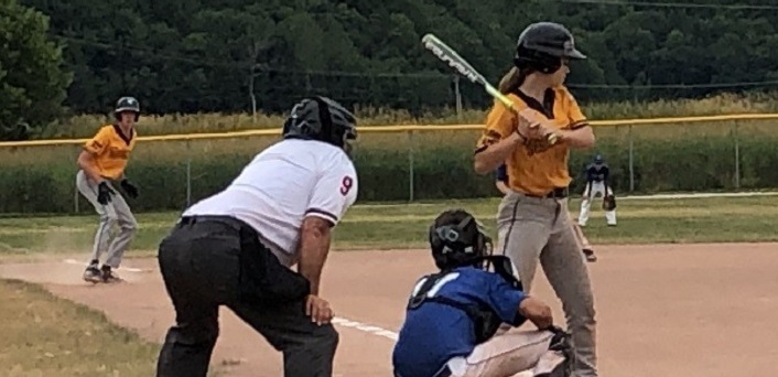 Muskoka Hornet Hannah Collett bats with Winston Young threatening to score from third base during the 2019 Muskoka Cup