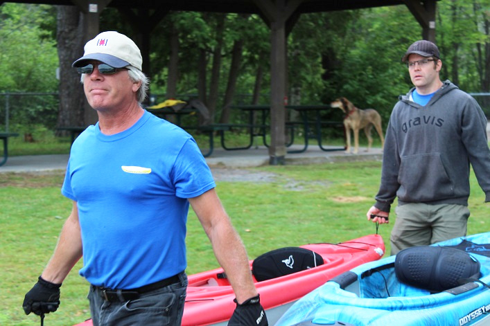Paul McKinnon and Robert Edmonstone carried the paddlers canoes and kayaks to the water at Hutcheson Beach