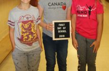 (From left) Daniel, Ella, and Sophie on the first day of school (supplied)