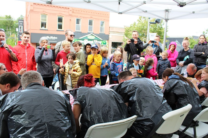 The pie-eating contest drew a crowd to the Town Hall steps