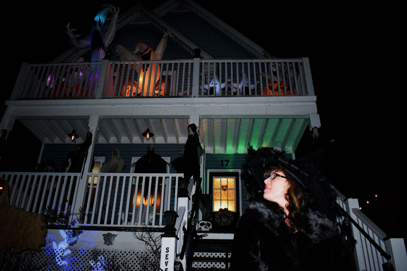 For Kandis Sinister, embracing the darker side of life has allowed her to express her love for all things strange and unusual. Here, she sits in front of her Florence Street East home she shares with her husband Troy. They might get close to 200  candy-seeking kids tonight.