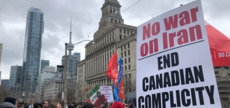 Demonstrators protest President Donald Trump’s ordering of the death of top Iranian general, Qassem Soleimani, at the U.S. Consulate in Toronto (Angelina King/CBC)
