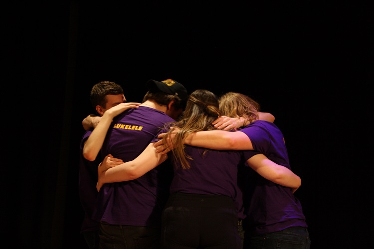 Huntsville’s Bravo Squad pauses for a team hug to celebrate their win. (Madi Jones)