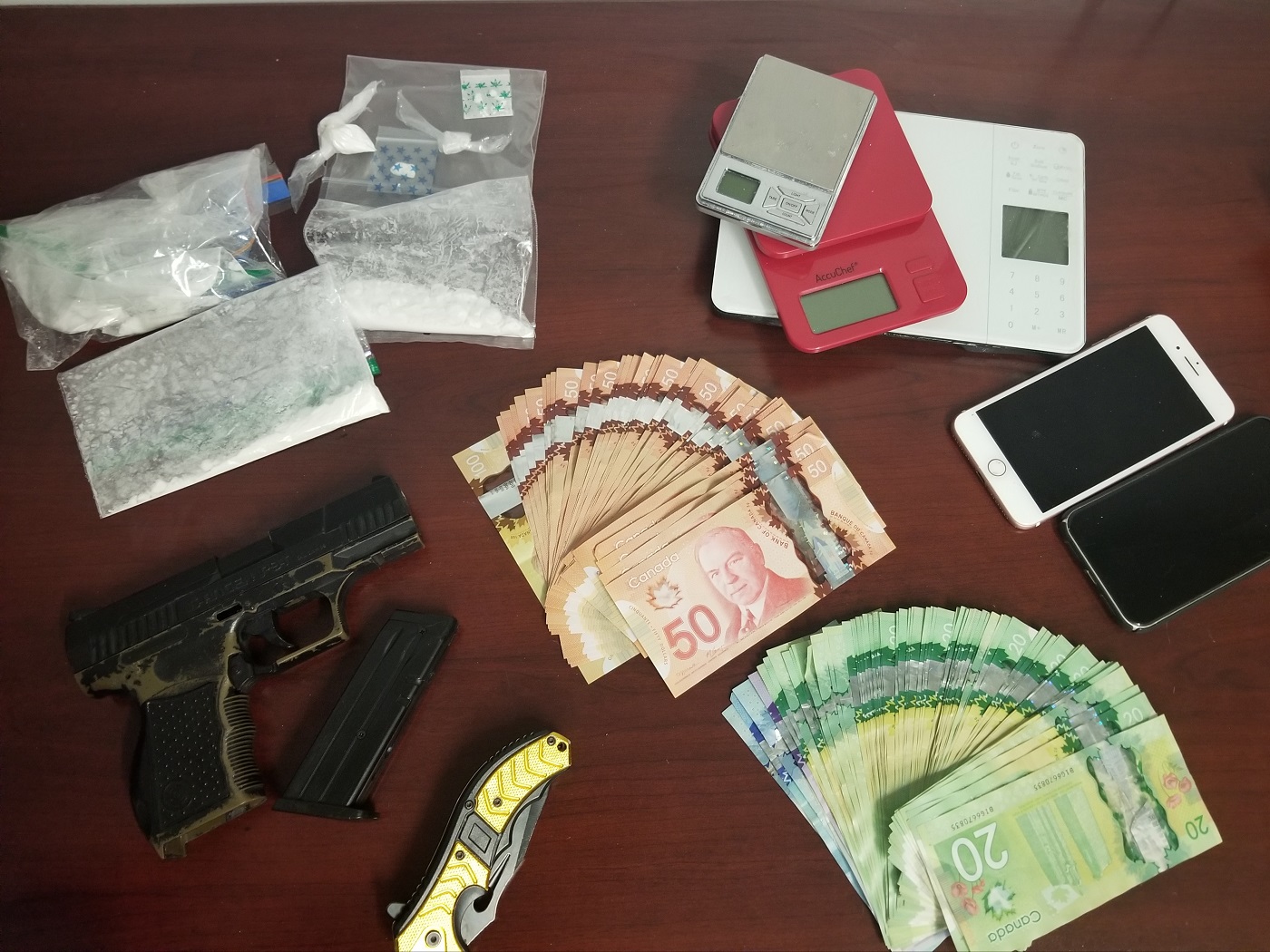 Drugs, cash and weapons seized during a search warrant at a Dwight residence on April 9 (OPP)