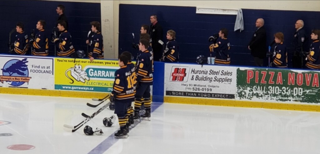 Marc Gagnon (back, second from left) on the bench with the Otters (Deb Reynolds)
