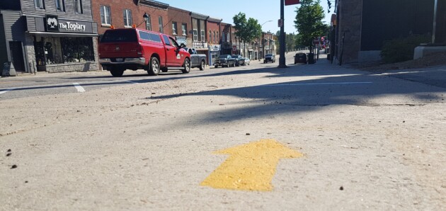 Main Street now has directional arrows to encourage physical distancing