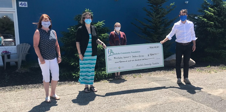 Stay at Home Gala organizer Beth Goodhew (left) and MCF chair Daniel Bradbury (right) present a cheque for $9,600 to Jennifer Bell of Muskoka Women’s Advocacy Group. (supplied)