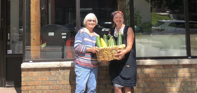 Muskoka North Good Food Co-op board chair Susan McGrath (left) and general manager Kelli Ebbs in front of the co-op’s new location on Main Street (Sydney Allan)