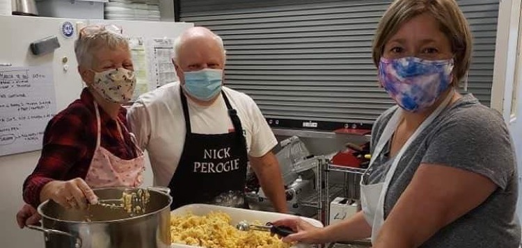 (From left) Rose Evans, Nick Paroschy and Christine Kropp make perogies (supplied)