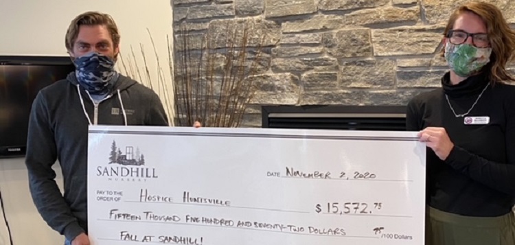 Tim Cantelon (left), owner of Sandhill Nursery, presents a cheque to Rebecca Ellerson, executive director of Hospice Huntsville (supplied)