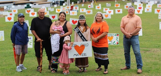 Commemorative signs raise awareness about residential schools and the need to implement TRC calls to action