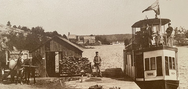 Albert-Sydney-Smith-his-steamer-the-Gem-and-a-load-of-tan-bark-ready-to-be-shipped-to-the-tannery-in-Huntsville-circa-1905.jpg