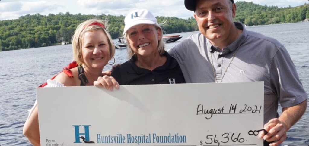 Tracy (left) and John di Cesare present a cheque for the proceeds from the inaugural Joker’s Wild Poker Run to Huntsville Hospital Foundation executive director, Katherine Craine (centre). (supplied)
