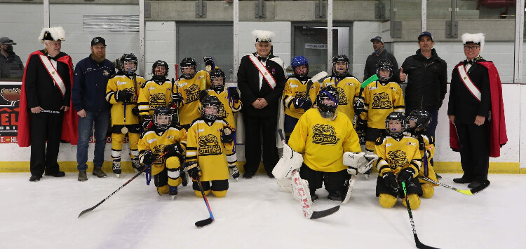 The U11LL Coldwell Banker, pictured with members of the Knights of Columbus, earned a spot in the U11LL Gold Championship game. (supplied)