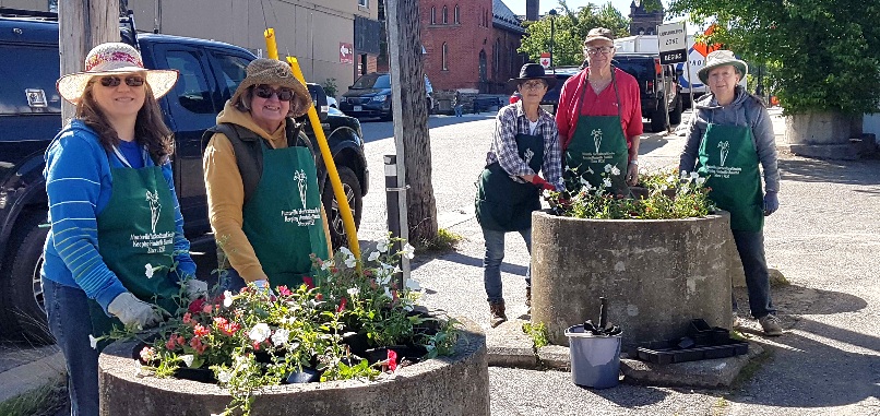 Huntsville Horticultural Society members beautifying downtown Huntsville (Tamara de la Vega)
