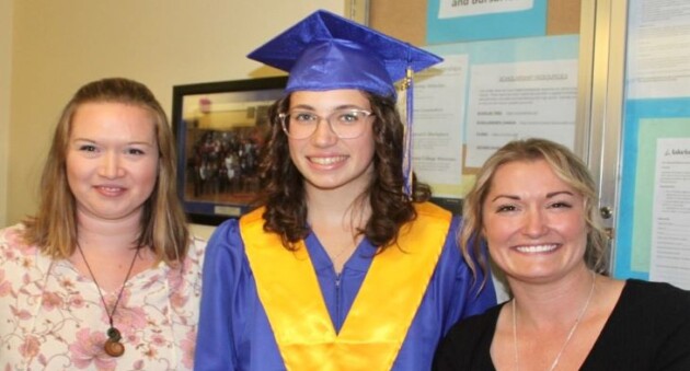 Two students are each presented with a $1,000 scholarship by the Kiwanis Club of Huntsville Muskoka