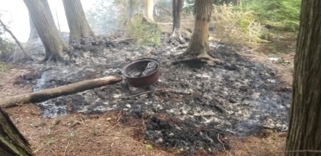 Fire department responds to brush fire caused by unattended camp fire
