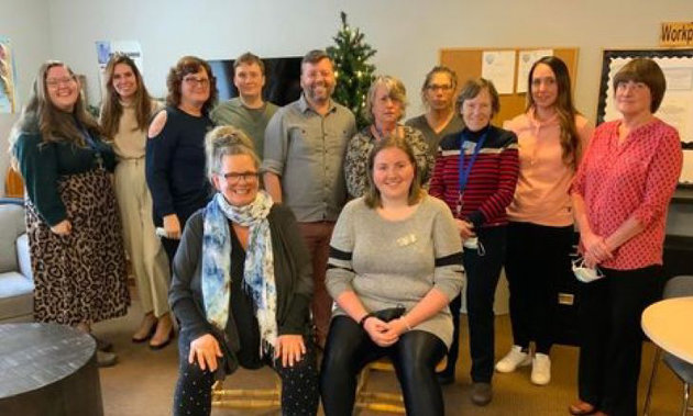 De Novo staff donate funds for youth mental health initiative