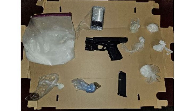 Loaded firearm and drugs located in vehicle stopped for speeding