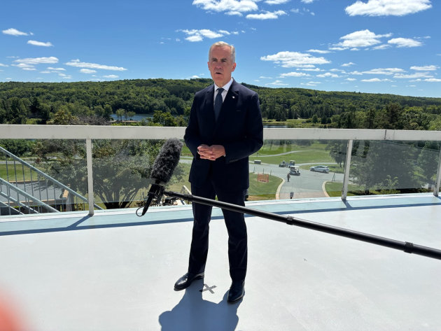 Prime Minister Mark Carney speaks to reporters at Deerhurst Resort